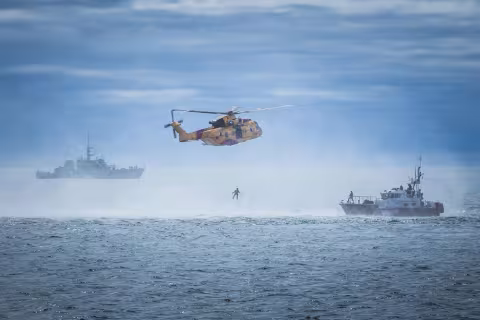 helicopter performing rescue at sea